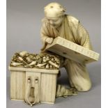 A FINE QUALITY SIGNED JAPANESE MEIJI PERIOD IVORY OKIMONO OF A KNEELING MAN, opening a weaved