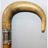 A 19TH CENTURY RHINOCEROS HORN HANDLED WOOD WALKING STICK, with a hallmarked silver collar, the