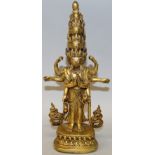 A GOOD QUALITY TIBETAN OR NEPALESE GILT BRONZE MULTI-HEADED DEITY, possibly 18th/19th Century, the