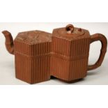 A 19TH CENTURY CHINESE YIXING POTTERY DOUBLE TEAPOT & COVER, of double hexagonal form, the sides