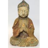 A CHINESE LACQUERED WOOD FIGURE OF BUDDHA, seated in dhyanasana, his hands in a prayerful