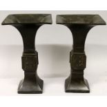 A PAIR OF 16TH/17TH CENTURY CHINESE MING DYNASTY BRONZE SQUARE SECTION GU VASES, with wide flaring