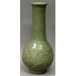 A CHINESE LONGQUAN MING DYNASTY CELADON PORCELAIN BOTTLE VASE, the sides moulded underneath the