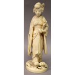 A SIGNED JAPANESE MEIJI PERIOD IVORY OKIMONO OF A BIJIN, walking in geta and holding a closed