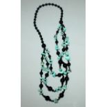A CHINESE TURQUOISE AND ONYX TYPE NECKLACE.