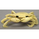 AN EARLY 20TH CENTURY ORIENTAL ARTICULATED IVORY CRAB, with moveable feet and claws, 5.25in wide