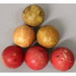 A GROUP OF SIX EARLY 20TH CENTURY IVORY SNOOKER BALLS, three stained red, approx. 2in diameter. (6)