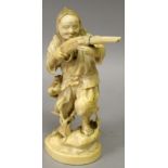 A SIGNED JAPANESE MEIJI PERIOD IVORY OKIMONO OF A HUNTER, standing on rockwork and aiming a