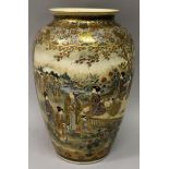 A GOOD QUALITY SIGNED JAPANESE MEIJI PERIOD SATSUMA EARTHENWARE VASE, the sides painted with figural