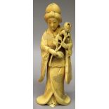 A GOOD QUALITY SIGNED JAPANESE MEIJI PERIOD IVORY OKIMONO OF A BIJIN, standing in floral engraved