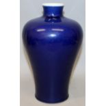 A CHINESE BLUE GLAZED MEIPING PORCELAIN VASE, the sides applied with an even glaze thinning slightly