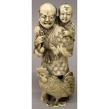 A JAPANESE MEIJI PERIOD IVORY OKIMONO OF A FARMER, with worried expression carrying his son upon his