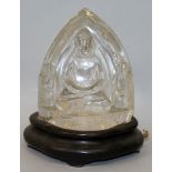 A 20TH CENTURY THAI ROCK CRYSTAL CARVING OF BUDDHA, together with a bulb-fitted wood stand, the