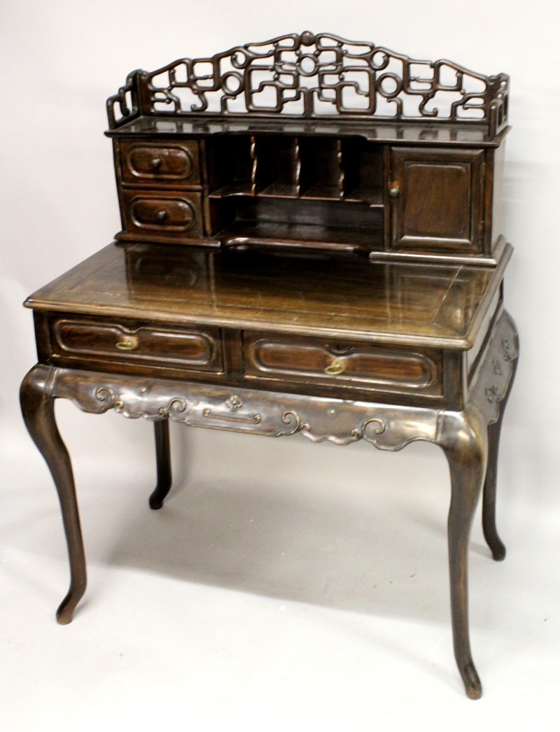 A 19TH CENTURY CHINESE HARDWOOD DESK, with pierced cresting rail, two small drawers, a small