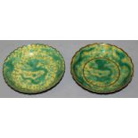 A PAIR OF CHINESE GREEN ENAMELLED YELLOW GROUND PORCELAIN DRAGON DISHES, each with a wavy rim,