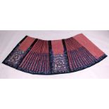 A GOOD QUALITY 19TH CENTURY CHINESE EMBROIDERED SILK SKIRT, lacking its waistband, decorated in