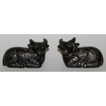 A SMALL PAIR OF 19TH/20TH CENTURY CHINESE BRONZE MODELS OF RAMS, each recumbent animal with