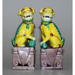 A SMALL PAIR OF 20TH CENTURY CHINESE FAMILLE VERTE YELLOW GROUND PORCELAIN MODELS OF BUDDHISTIC