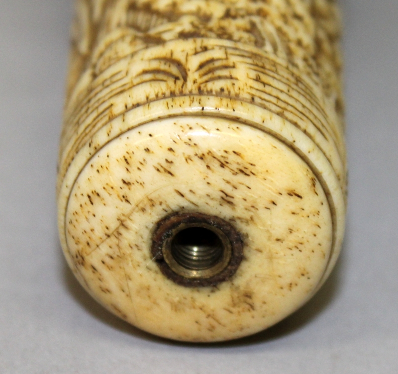 AN EARLY 20TH CENTURY ORIENTAL CARVED BONE CANE HANDLE, with a carved wood and glass inset pommel, - Image 5 of 5