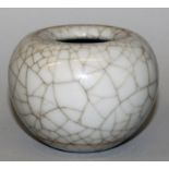 A CHINESE CRACKLEGLAZE PORCELAIN WATER POT, the base with a Yongzheng seal mark, 3.9in wide at