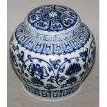 A CHINESE MING STYLE BLUE & WHITE PORCELAIN JAR & COVER, the sides decorated with a formal design of