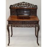 A GOOD 19TH CENTURY CHINESE HARDWOOD DESK, with pierced dragon carved cresting above a small