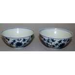 A PAIR OF CHINESE BLUE & WHITE MING STYLE PORCELAIN BOWLS, each decorated with a design of scrolling