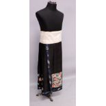 A FINE QUALITY 19TH CENTURY CHINESE EMBROIDERED & PLEATED SILK SKIRT, decorated in satin and knot