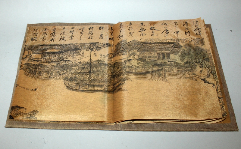 A CHINESE PICTURE BOOK, with fabric covers, opening to reveal a long folding continuous scene on - Image 5 of 10