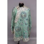 A GOOD 19TH CENTURY LADY'S LIME GREEN GROUND EMBROIDERED SILK ROBE, decorated over a patterned