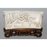 A FINE QUALITY 19TH CENTURY CHINESE IVORY WRIST REST, together with a fitted carved hardwood display