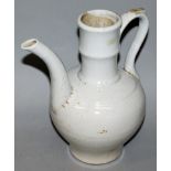 A CHINESE FUKIEN WHITE GLAZED PORCELAIN EWER, possibly Ming Dynasty, the neck ribbed, the base