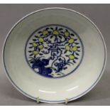 A GOOD QUALITY CHINESE DOUCAI PORCELAIN SAUCER DISH, the interior centre and exterior sides