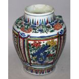 A 17TH CENTURY CHINESE TRANSITIONAL PERIOD WUCAI PORCELAIN VASE, the sides painted with panels of