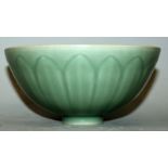 A CHINESE YUAN STYLE LONGQUAN CELADON PORCELAIN BOWL, the sides moulded beneath the glaze with