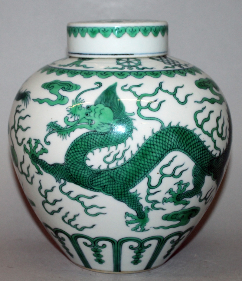 A GOOD QUALITY CHINESE GREEN ENAMELLED PORCELAIN DRAGON JAR & COVER, the sides decorated with two