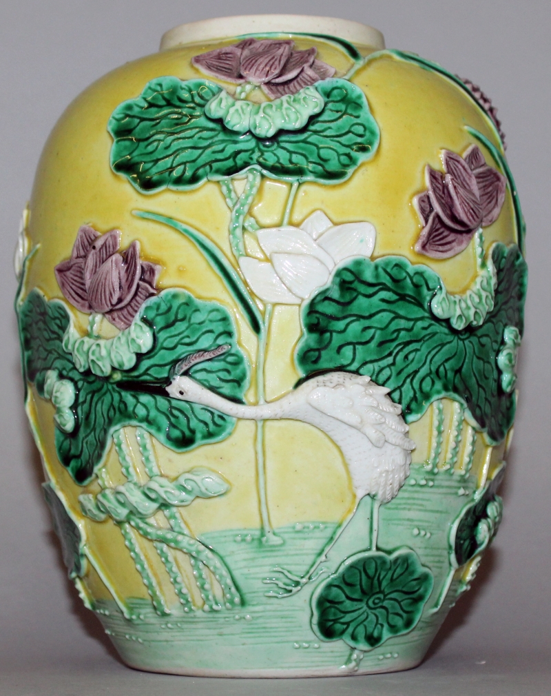 AN EARLY 20TH CENTURY CHINESE WANG BINRONG YELLOW GROUND PORCELAIN JAR, the sides moulded in