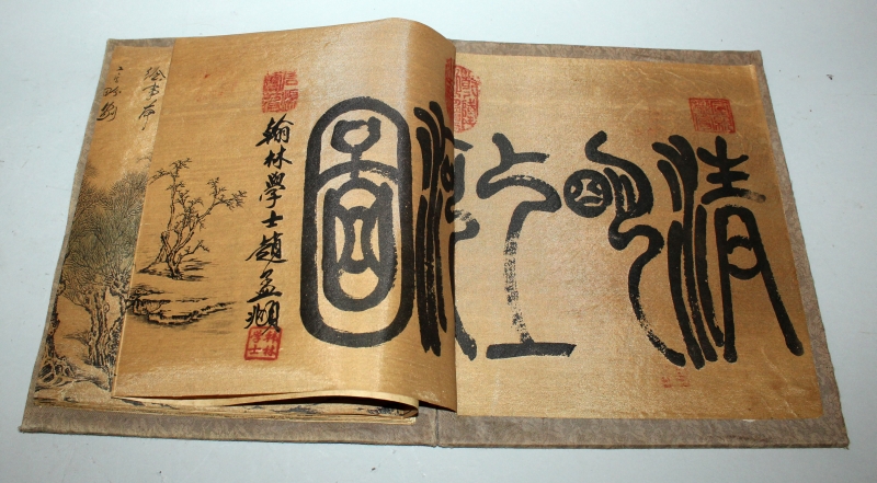 A CHINESE PICTURE BOOK, with fabric covers, opening to reveal a long folding continuous scene on - Image 2 of 10