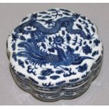 A CHINESE BLUE & WHITE PORCELAIN BOX & COVER, of octofoil section, the cover decorated with a dragon