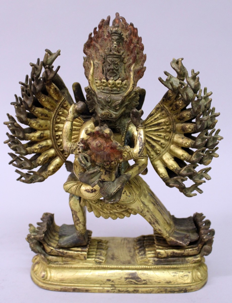 A GOOD QUALITY CHINESE SECTIONAL GILT BRONZE GROUP OF HAGAGRIVA & HIS CONSORT, the deity supported