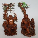 A PAIR OF FINE QUALITY 19TH CENTURY CHINESE CARVED BOXWOOD MODELS OF IMMORTALS, each with a boy