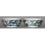 A SMALL PAIR OF CHINESE DOUCAI PORCELAIN DRAGON & PHOENIX BOWLS, each base with a six-character