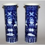 A PAIR OF 19TH CENTURY CHINESE BLUE & WHITE PORCELAIN VASES, each cylindrical body painted with