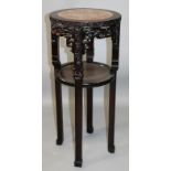 A 19TH CENTURY CHINESE MARBLE INSET HARDWOOD STAND, of circular form with a carved and pierced