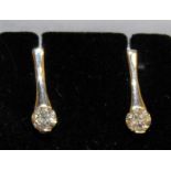 A PAIR OF DIAMOND DROP EARRINGS set in 14ct white gold.