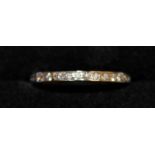 AN 18CT WHITE GOLD DIAMOND FULL ETERNITY RING.