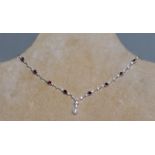A PRETTY 18CT WHITE GOLD RUBY AND DIAMOND NECKLACE with pearl drop.