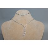 A SUPERB 14CT WHITE GOLD NECKLACE AND MATCHING BRACELET.
