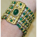 A VERY GOOD PEARL AND EMERALD SEVEN ROW BRACELET with cabochon emerald, pearl and diamond set clasp,