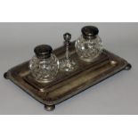 A VICTORIAN WALKER & HALL RECTANGULAR INKSTAND with two cut glass bottles and centre taperstick,